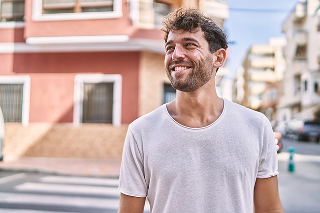 smiling man walking the streets of Texas