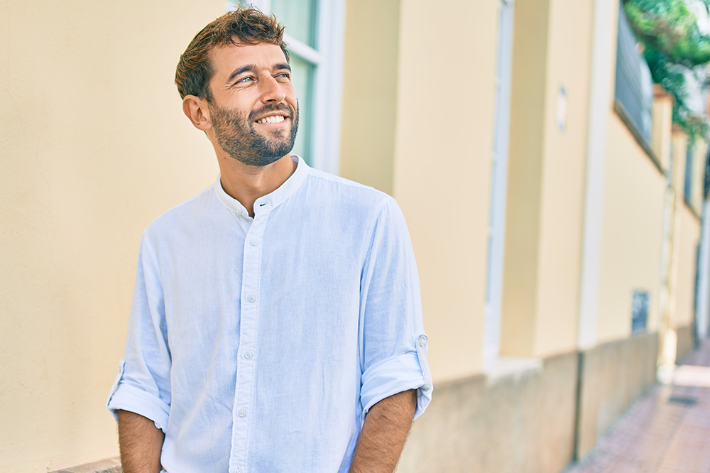 smiling man thinking about his legacy at mental wellness center