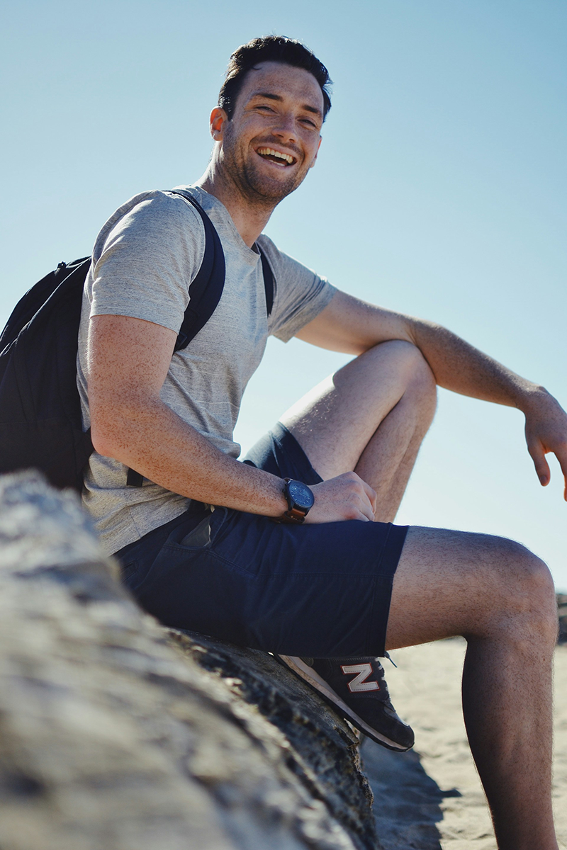 smiling man outside during mental wellness retreat